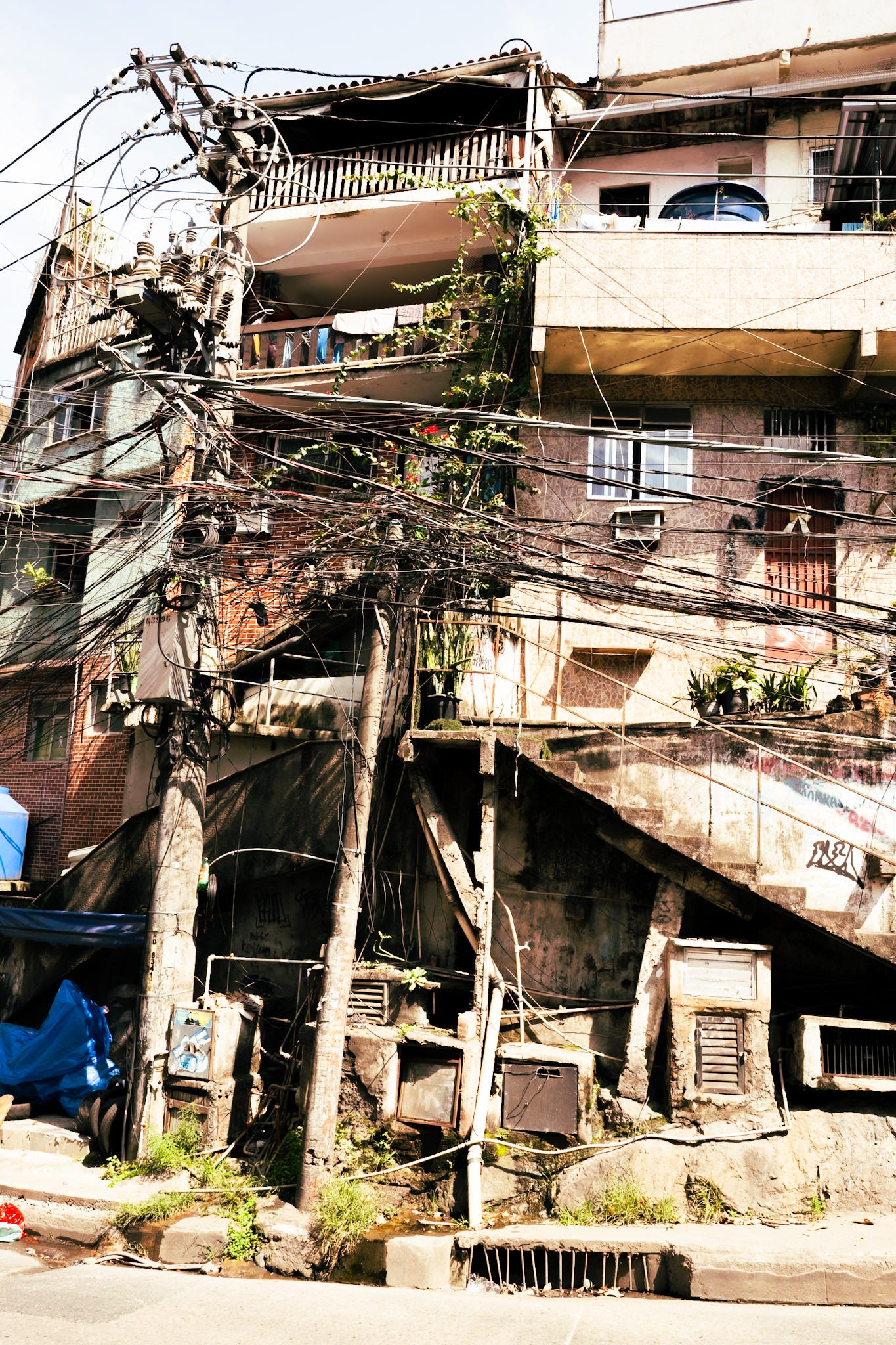 House with lots of electrical cables tangled in front of it