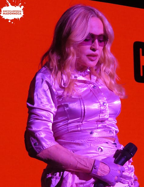 Madonna's dress came undone. She walked off, fixed it, returned.