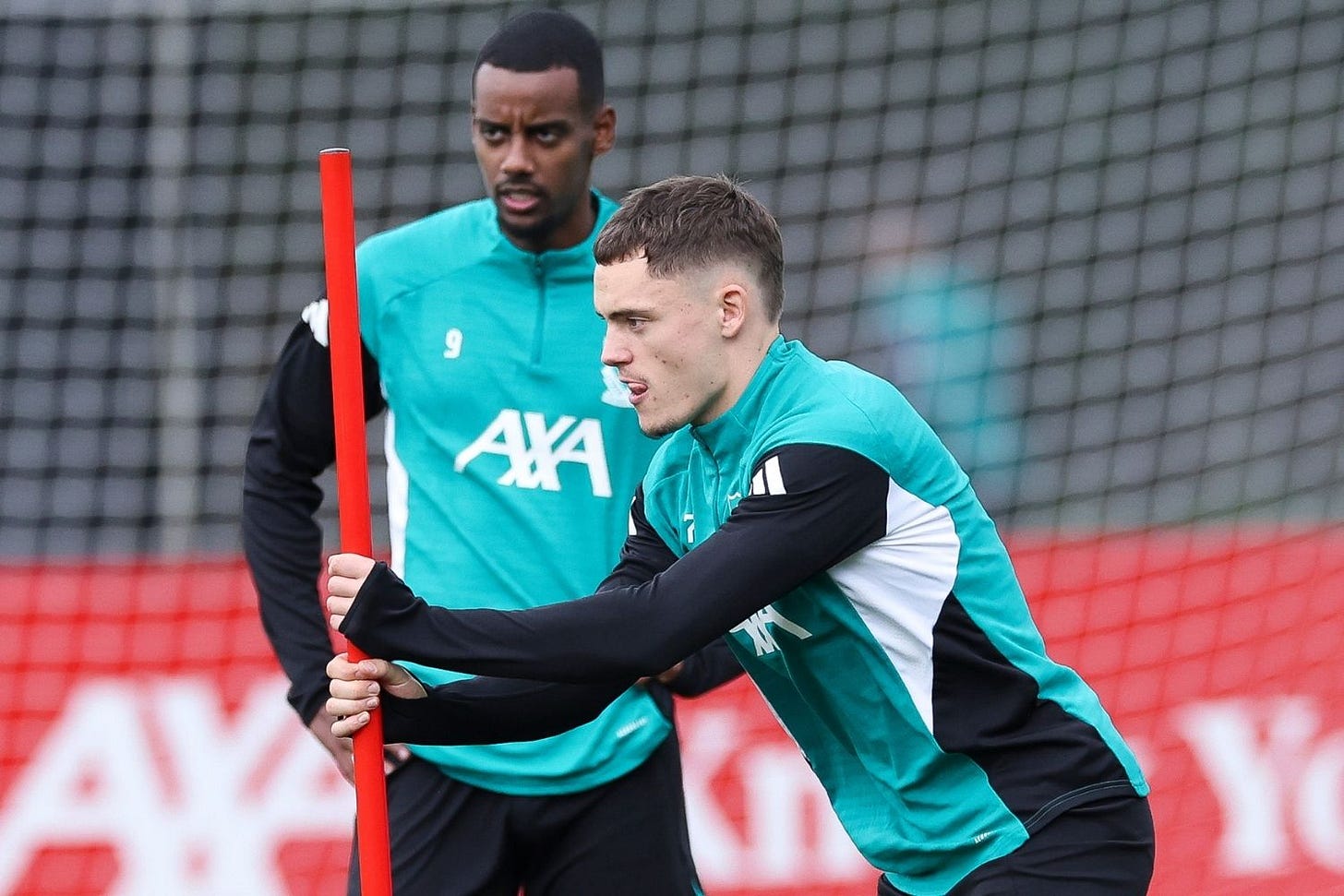 Florian Wirtz and Alexander Isak of Liverpool FC practice during a training session at AXA Melwood Training Centre