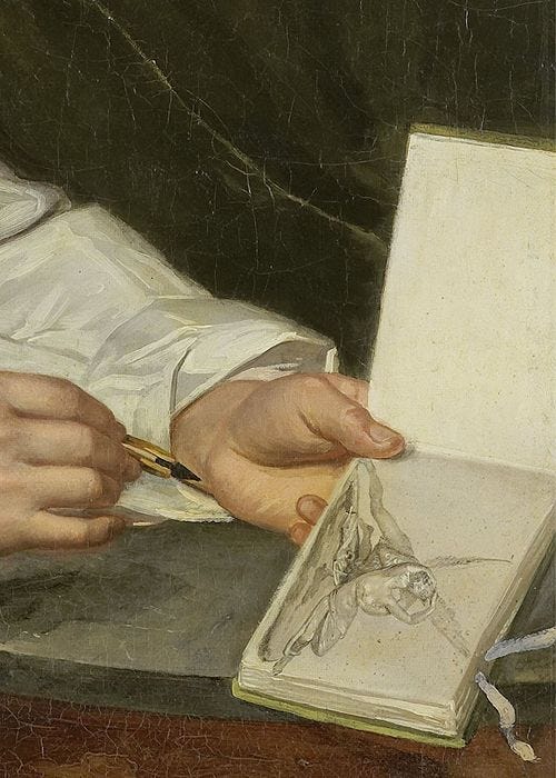 This may contain: a close up of a person writing on a book