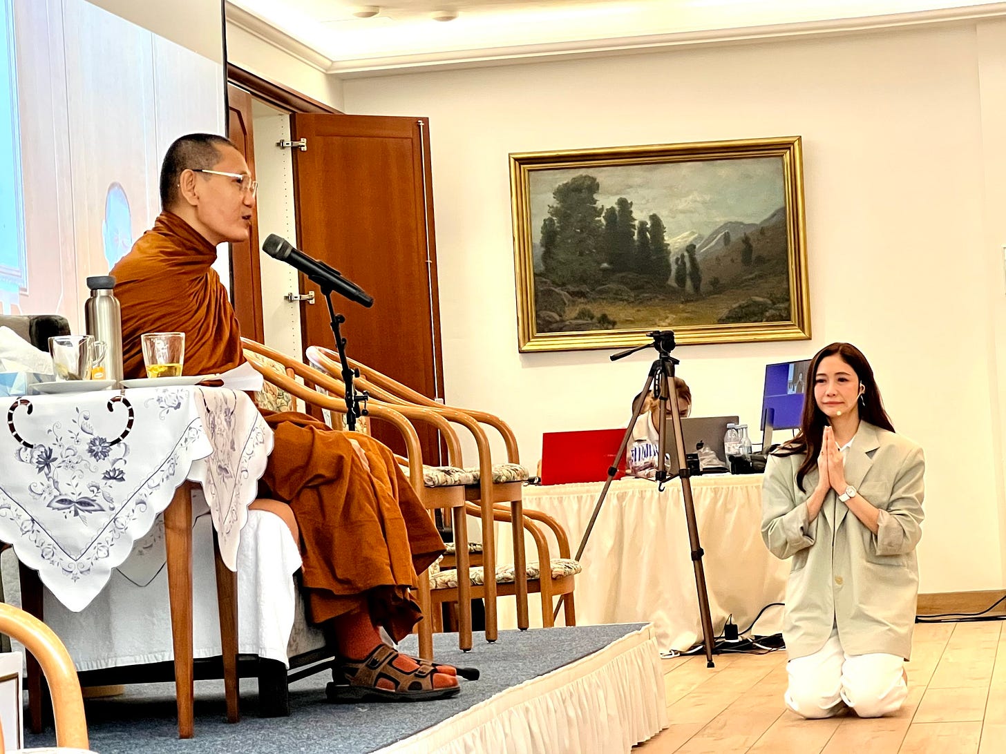 May be an image of 2 people, violin, flute, temple and text