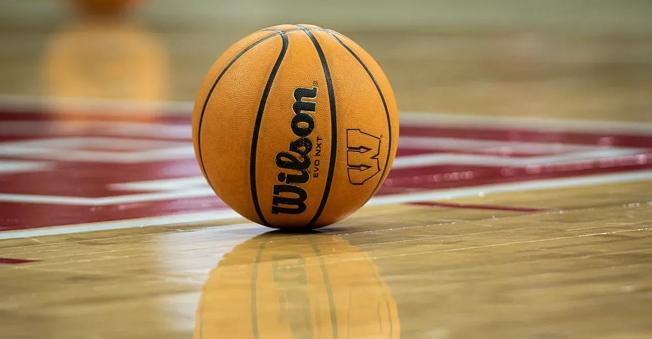 A Wisconsin Badgers-branded basketball sits on the Kohl Center floor