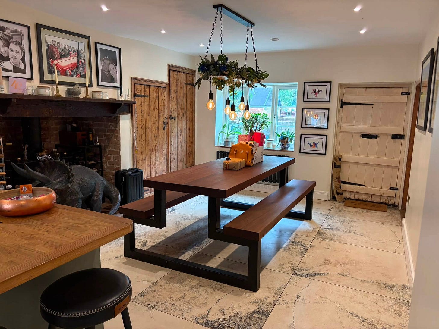 May be an image of table, kitchen island, indoors, sliding door, living room, barn door and hearth