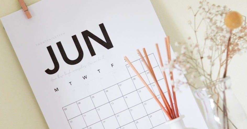 vase on book near calendar vase on book near calendar