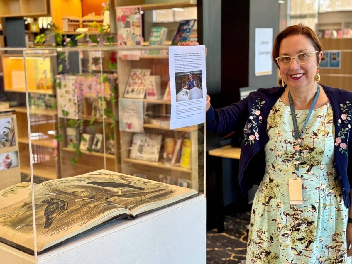 Karen Majoros at Springwood Library with the Birds of Australia by John and Elizabeth Gould.