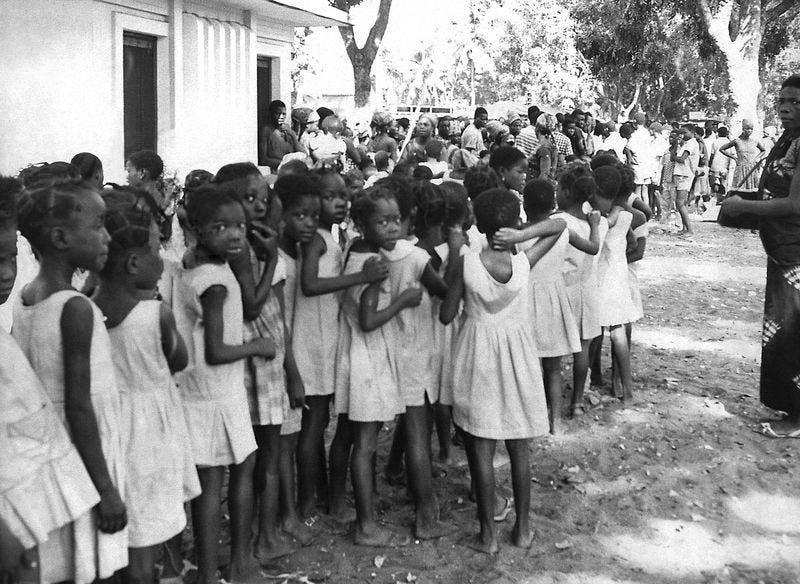 \u200bGroup of local children waiting to receive a smallpox inoculation contonou Benin.