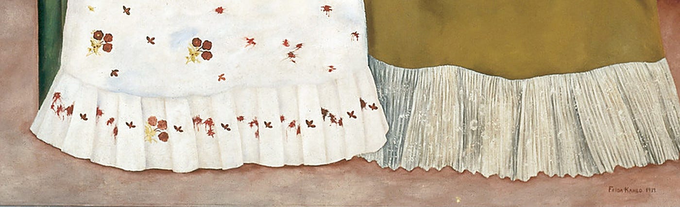 The bottom of both skirts covering the feet completely, with the painted floor visible below them. The bottom of both skirts covering the feet completely, with the painted floor visible below them.