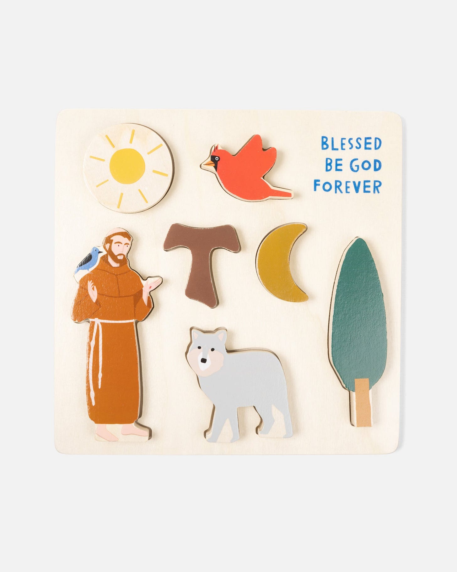 St. Francis Wooden puzzle with Francis, living cross, sun, moon, bird, wolf, and tree pieces.