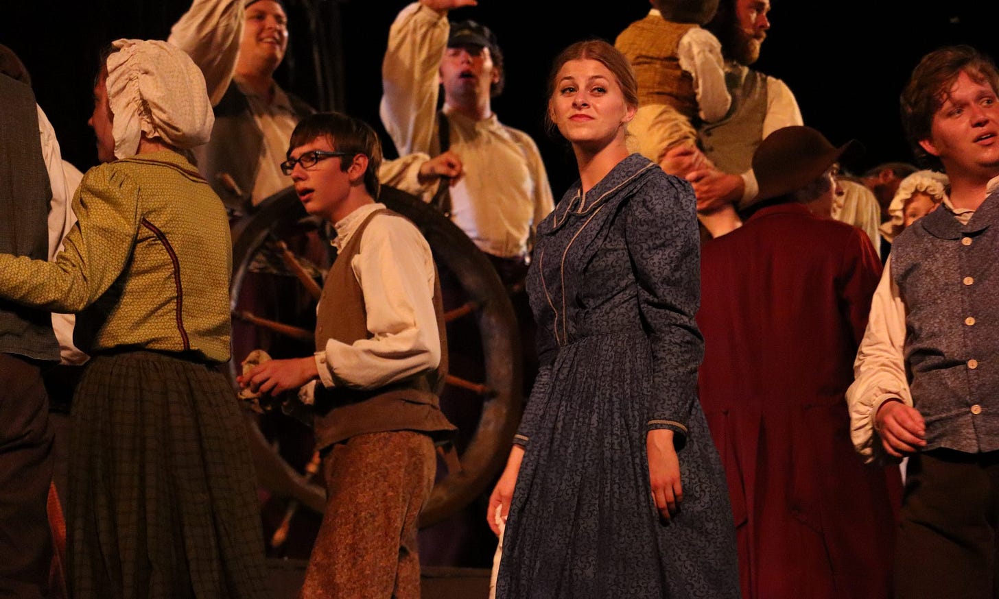 An actress in the British Pageant looking longingly back to the land she is leaving from the ship