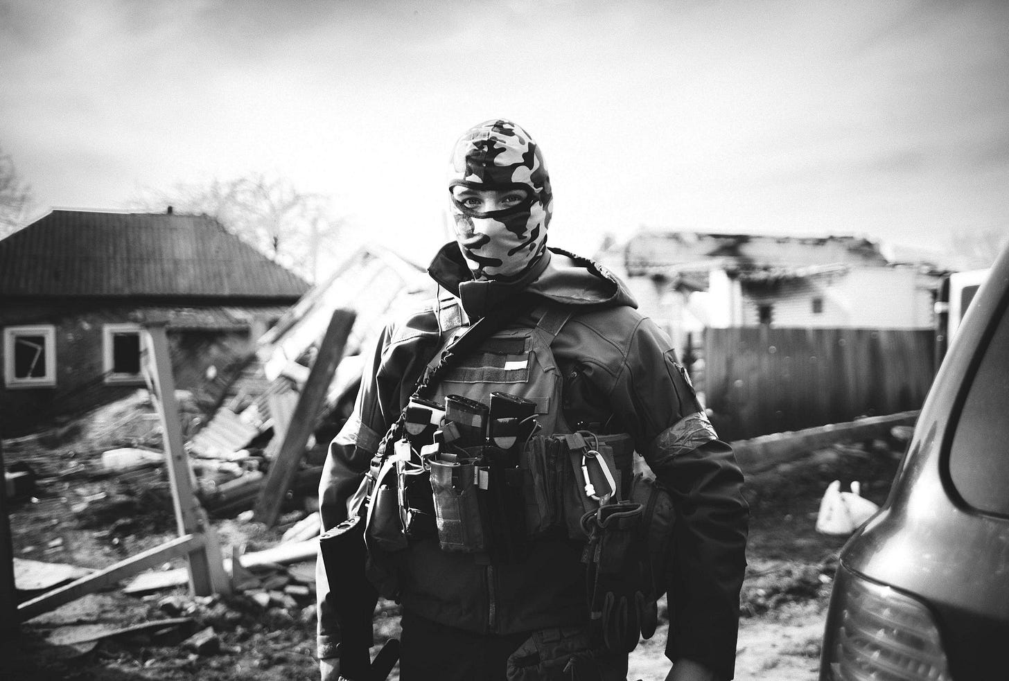 A soldier standing against what's left of house destroyed in a war. A soldier standing against what's left of house destroyed in a war.