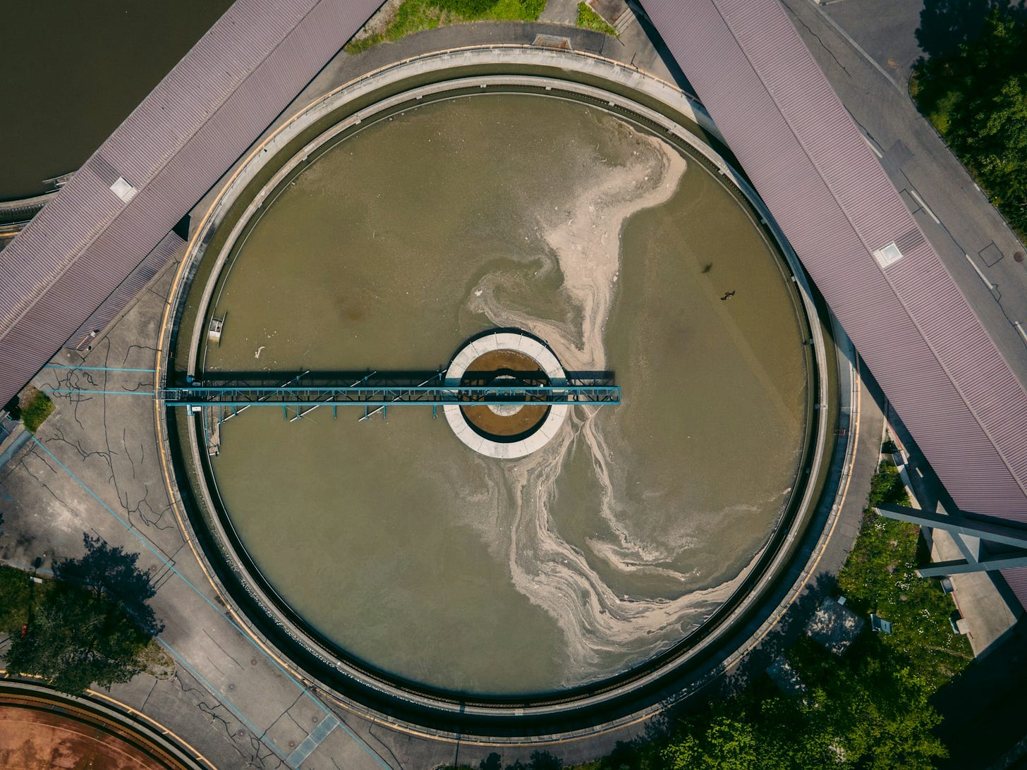 round gray and white round structure for sewage