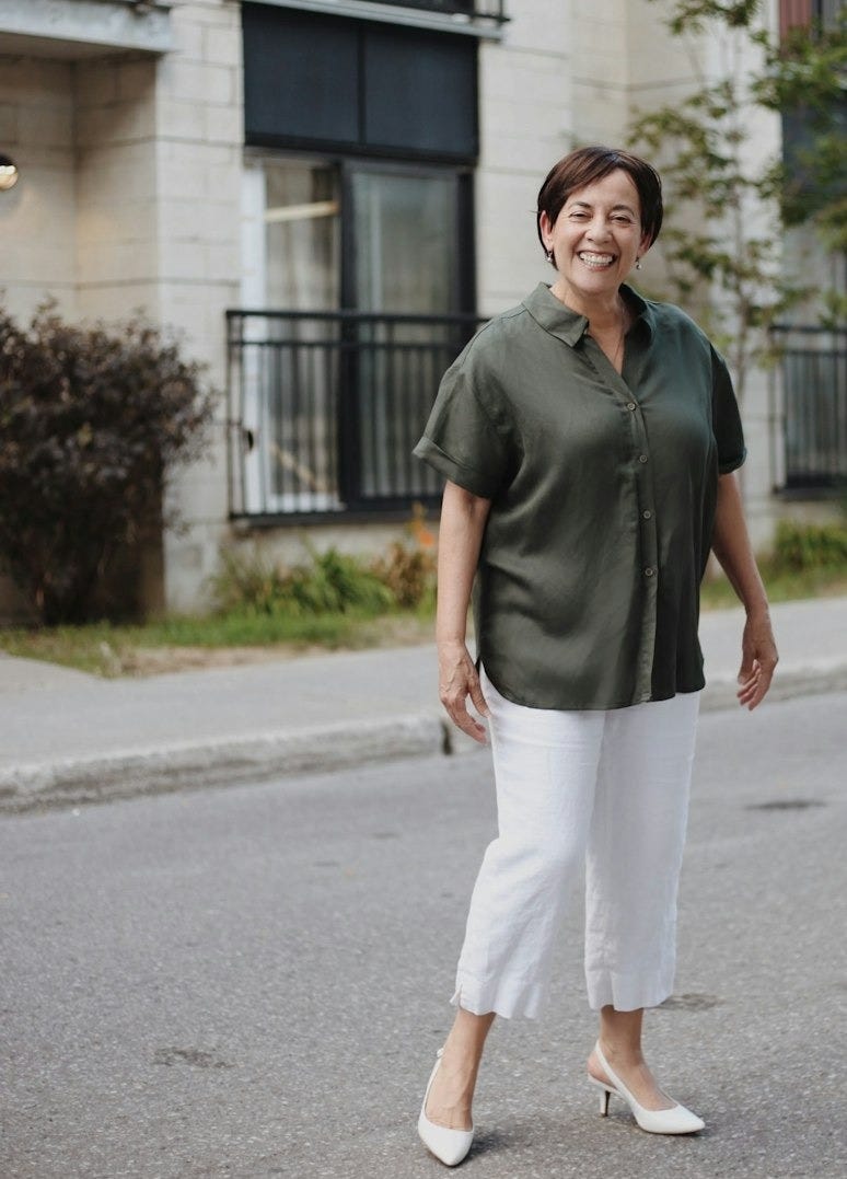 man in green polo shirt and white pants standing on road during daytime man in green polo shirt and white pants standing on road during daytime