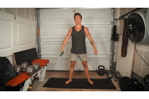 Brian squats in his garage. Brian squats in his garage.