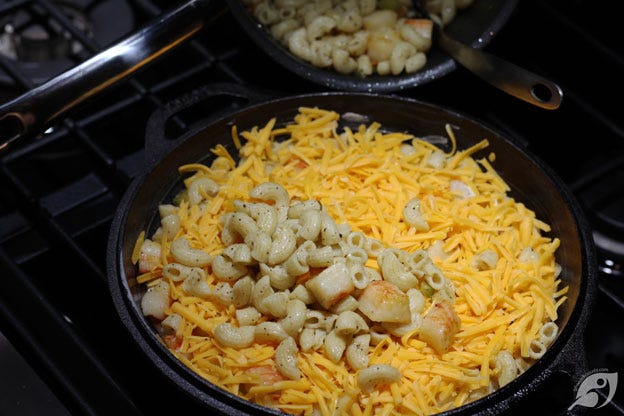 Then cover the layer with half of the grated Colby cheese. Repeat with another layer of the remaining macaroni, pepper, and lobster mixture. Then cover the layer with half of the grated Colby cheese. Repeat with another layer of the remaining macaroni, pepper, and lobster mixture.