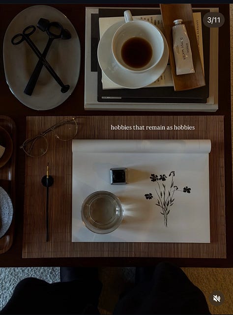 A collection of moody, low-lit photographs including a carefully arranged writing table with tea and ink, stacked journals on rumpled sheets, and a contemplative silhouette at sunset. The images balance structure and softness, suggesting ritual, reflection, and quiet becoming.