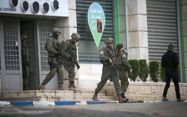 Israeli soldiers seen during a military raid in Tulkarem, in the West Bank, February 21, 2025. (Nasser Ishtayeh/Flash90) Israeli soldiers seen during a military raid in Tulkarem, in the West Bank, February 21, 2025. (Nasser Ishtayeh/Flash90)