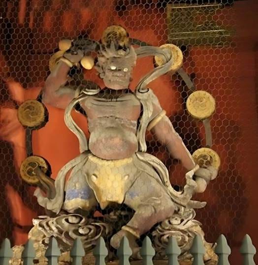Raijin temple guardian sculpture