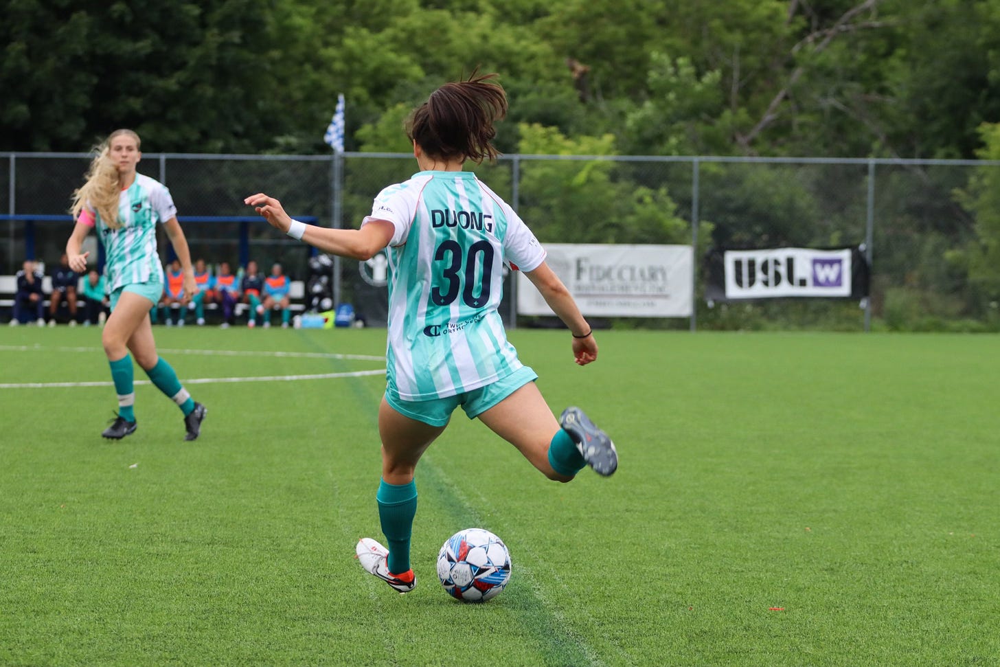 katie duong kicking the ball