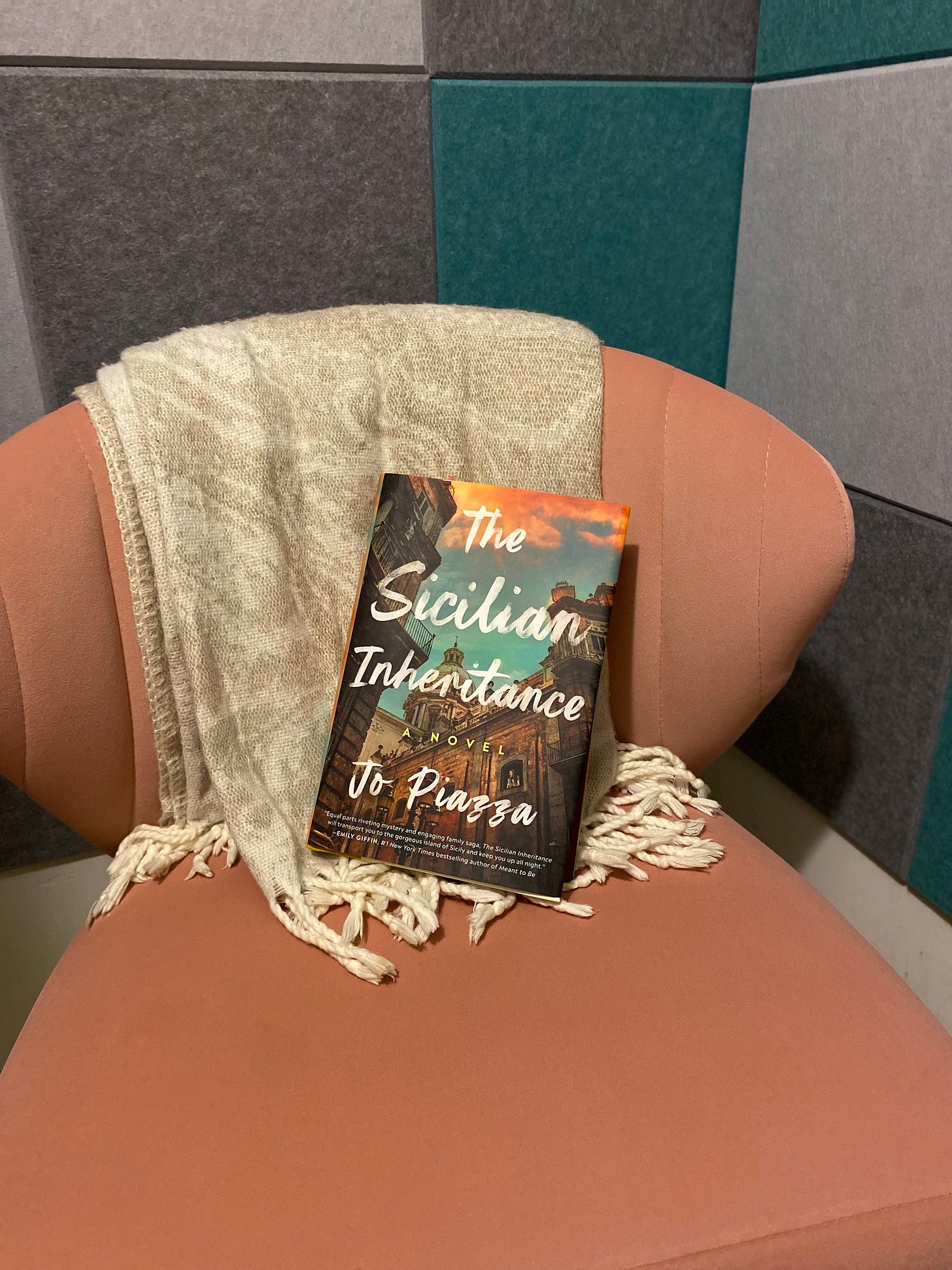 Book The Sicilian Inheritance placed in a pink chair
