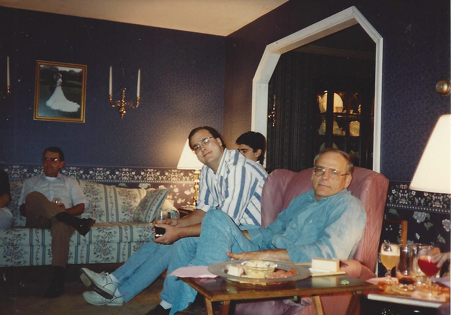 Extended family gathered in a living room to celebrate a holiday Extended family gathered in a living room to celebrate a holiday