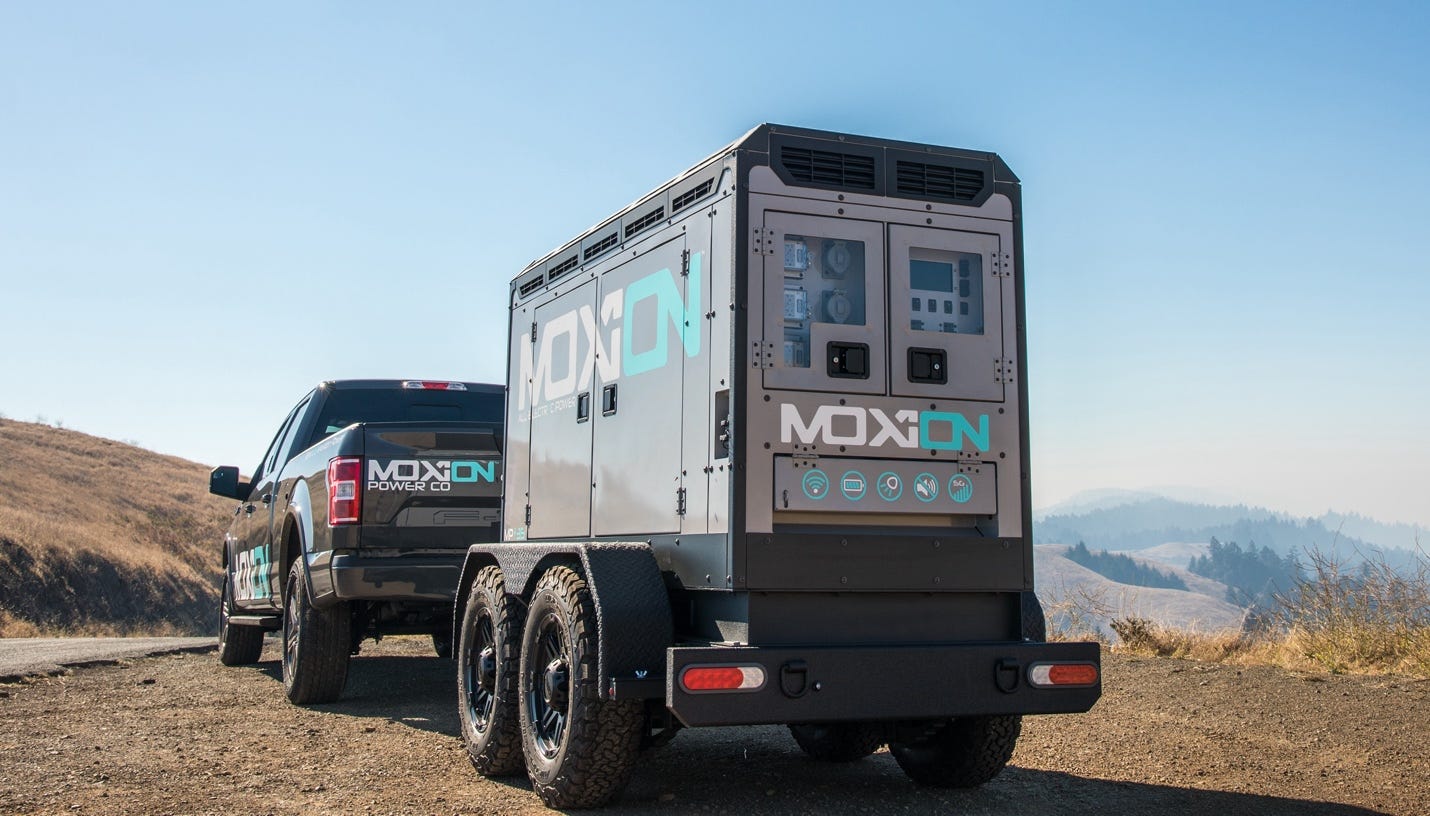 A picture containing text, sky, outdoor, truck

Description automatically generated