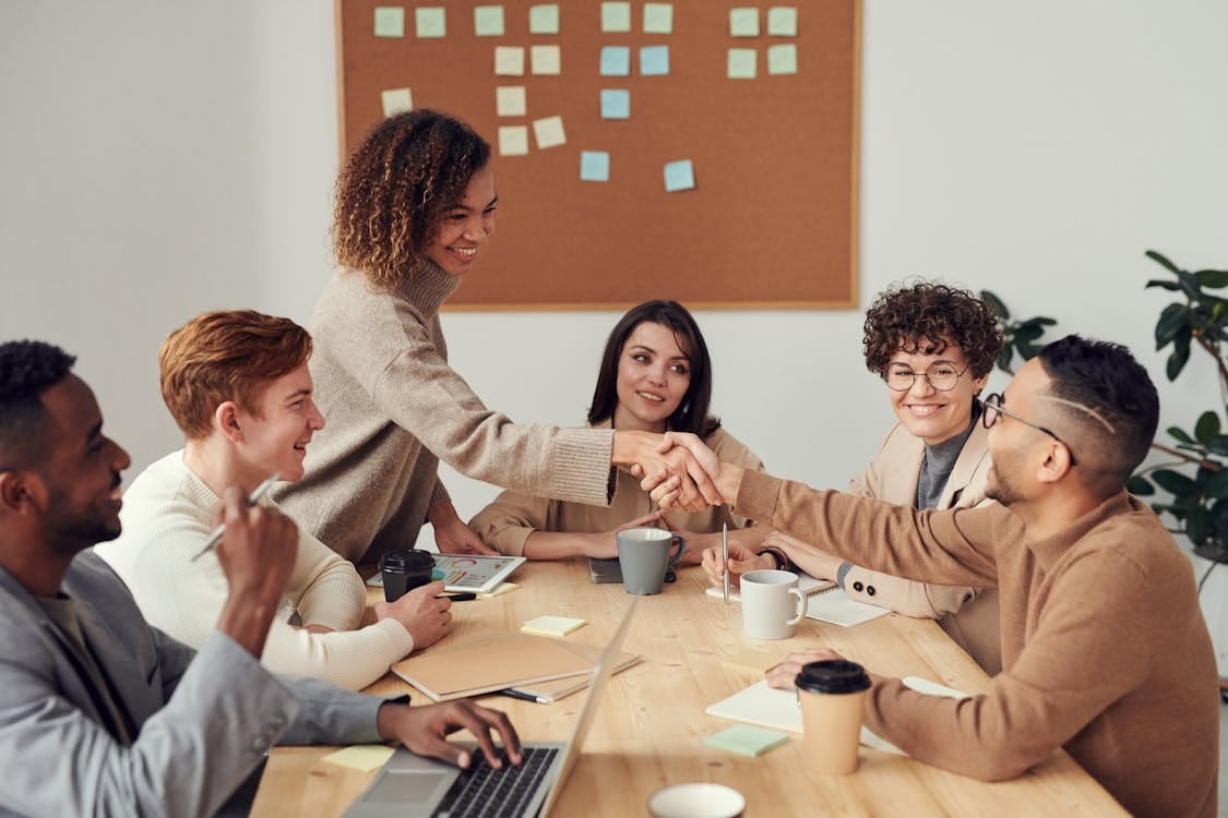 Colleagues Shaking each other's Hands · Free Stock Photo