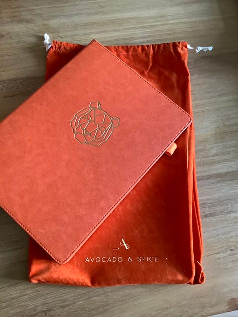 Orange notebook with velvet bag and box ready for writing poems into