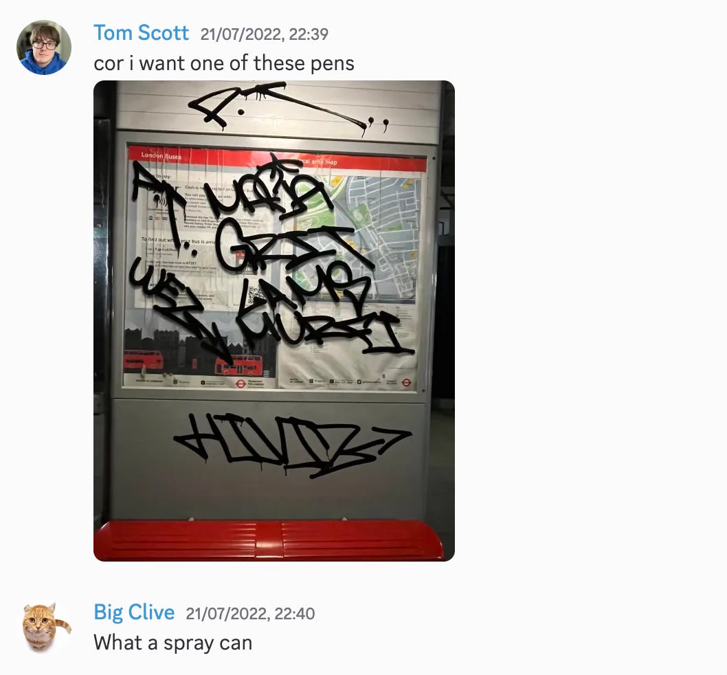 Screenshot of a chat conversation with a message "cor i want one of these pens" with an attached photo of a graffitied bus stop, followed by a message from another "What, a spray can?"