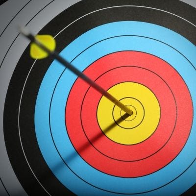 This may contain: an arrow hitting the center of a target This may contain: an arrow hitting the center of a target
