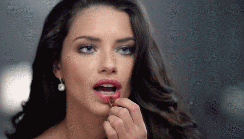 There's nothing hotter that Adriana Lima putting on her lipstick.