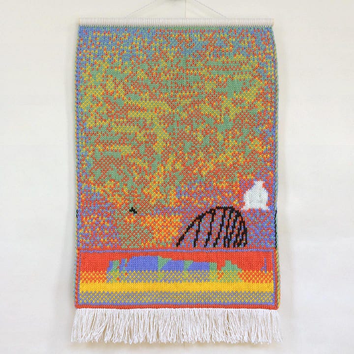 Two pieces of Katya Budkovskaya’s knitted art. The art is made out of pink, orange, blue, and green threads and knitted so that they sort of resemble digital, pixelated graphic art.