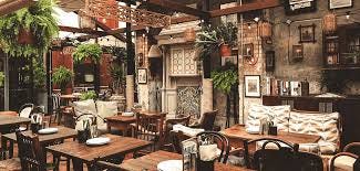 A restaurant with tables and chairs

Description automatically generated