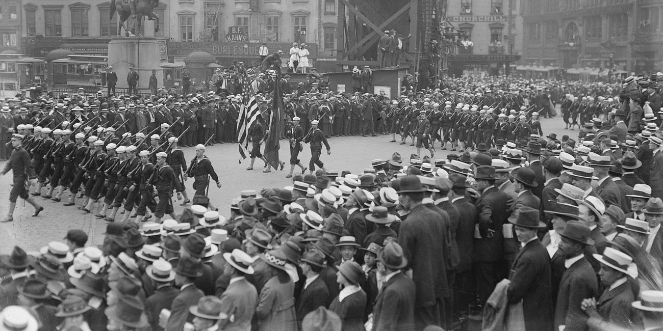 Terrorists Detonate Suitcase Bomb At WWI Parade, Killing 10