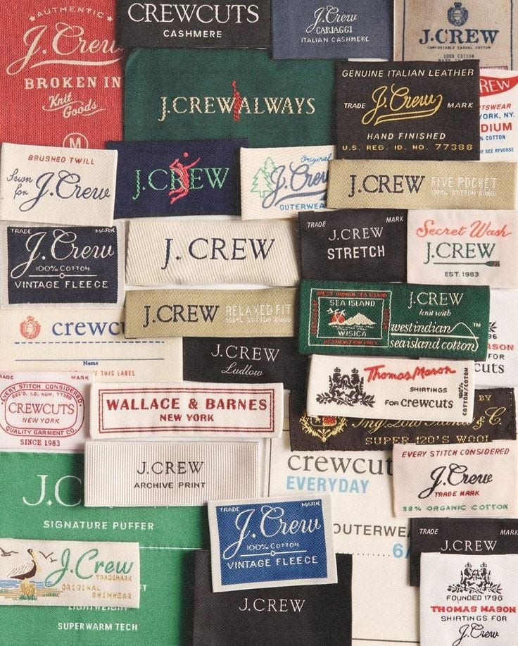 This may contain: many different types of wine labels on a white surface with black and red lettering that read j crew, j crew, j crew This may contain: many different types of wine labels on a white surface with black and red lettering that read j crew, j crew, j crew