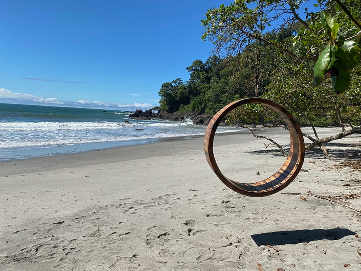 The pristine white beaches of Playitas and handsome bearded queer smiles as he sun basks in the glory of gay paradise in Costa Rica's Playitas Beach in Manuel Antonio