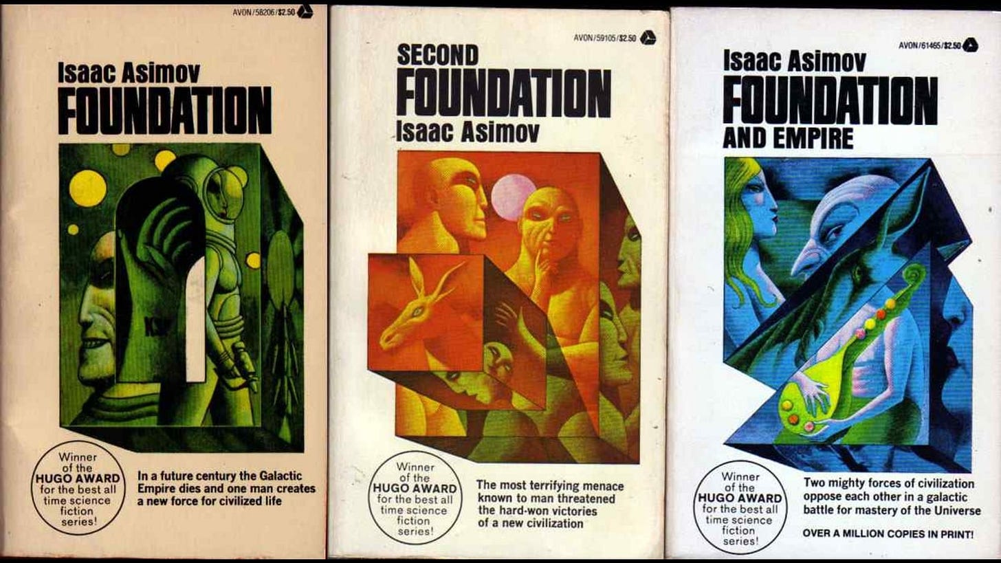 A collection of books with colorful designs
Description automatically generated