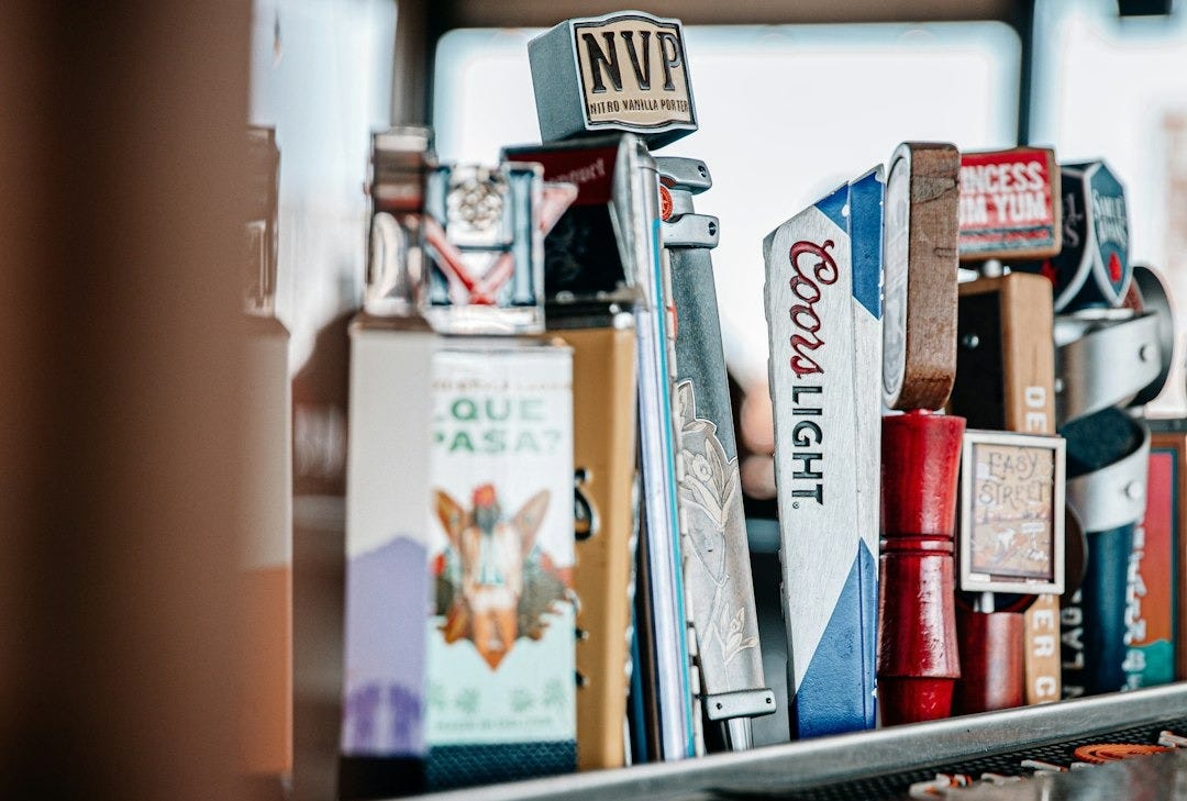 assorted chocolate bars on brown wooden table
