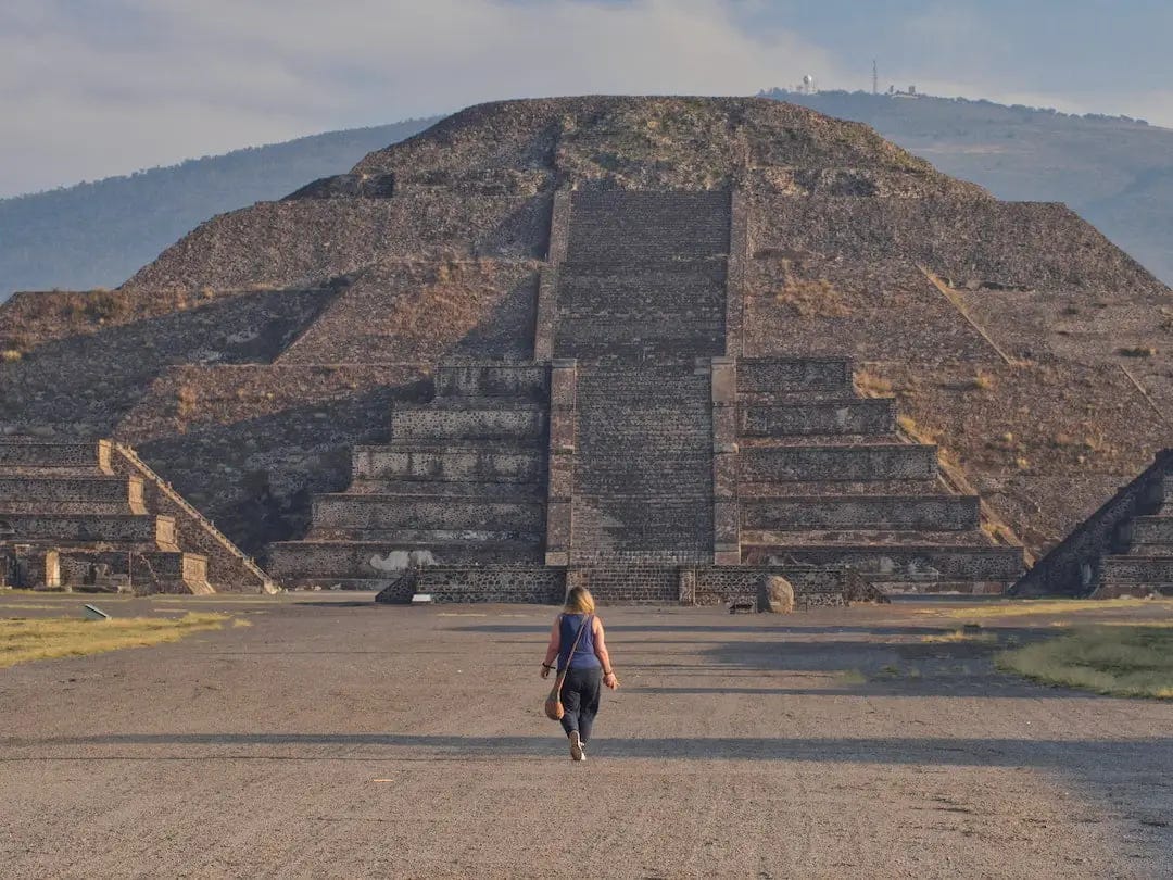  Nicky walking towards an ancient stepped pyramid