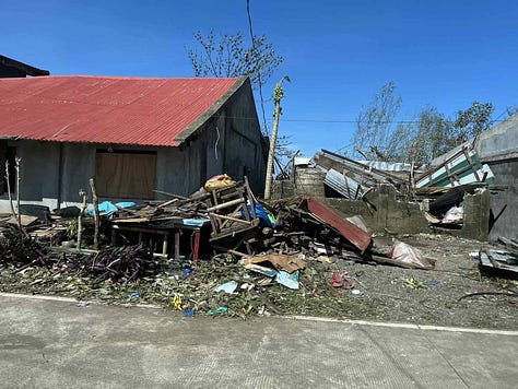 Super Typhoon Uwan (Fung-wong) destruction in Catanduanes, Philippines — homes in Barangay Mayngaway severely damaged after the November 2025 storm, documented by the Philippine Red Cross.