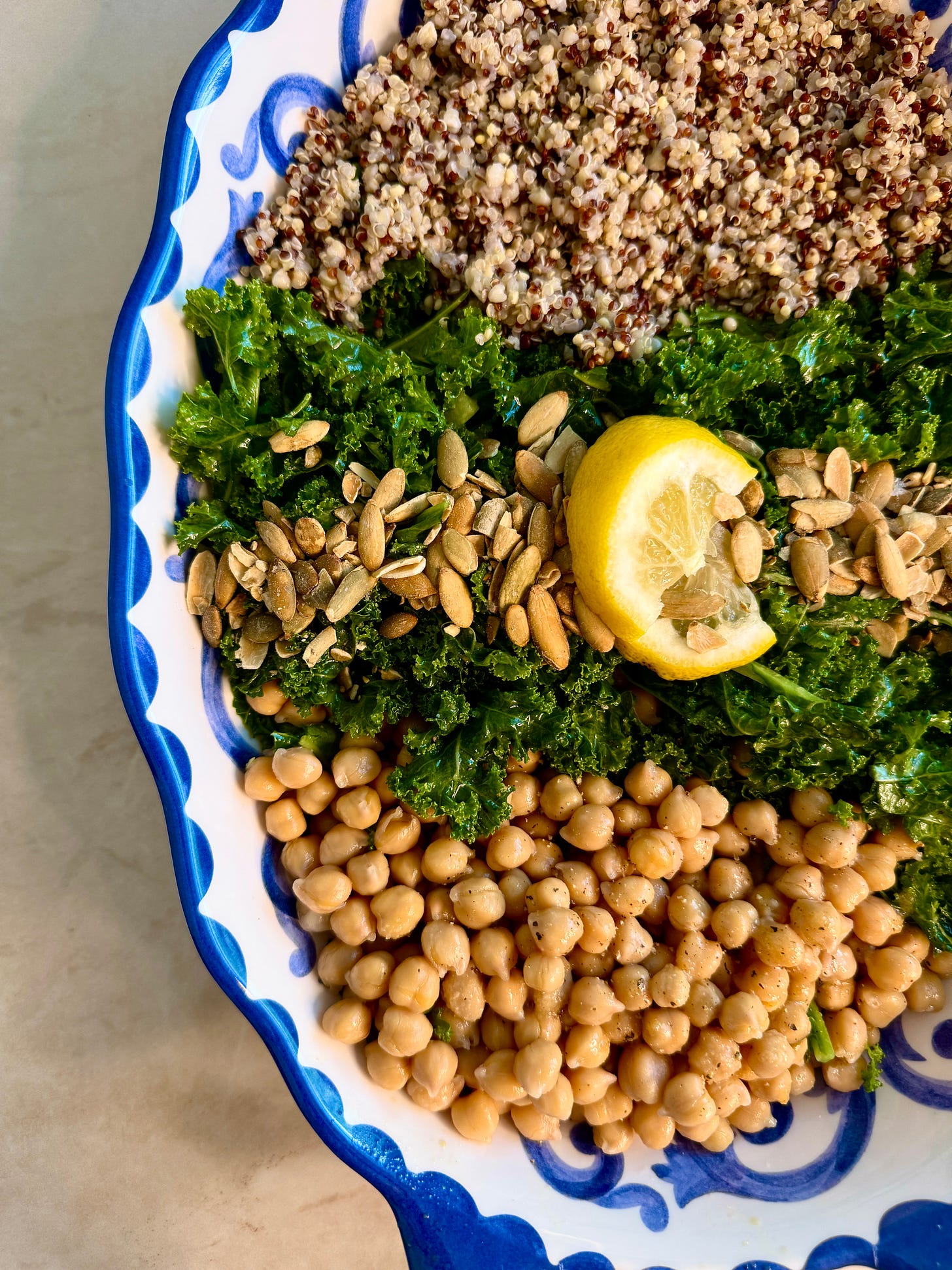 fluffy quinoa, massaged kale, peppered chickpeas, and crunchy pumpkin seeds all topped with a lemony sunshine dressing
