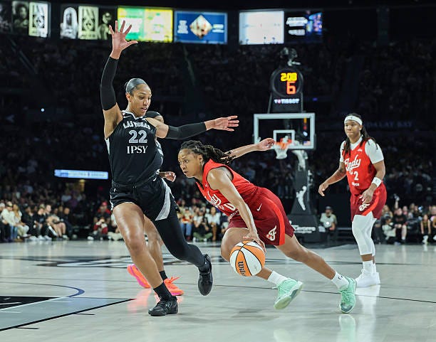 Kelsey Mitchell of the Indiana Fever drives to the basket against A'ja Wilson of the Las Vegas Aces in the third quarter of Game Three of the 2026... Kelsey Mitchell of the Indiana Fever drives to the basket against A'ja Wilson of the Las Vegas Aces in the third quarter of Game Three of the 2026...