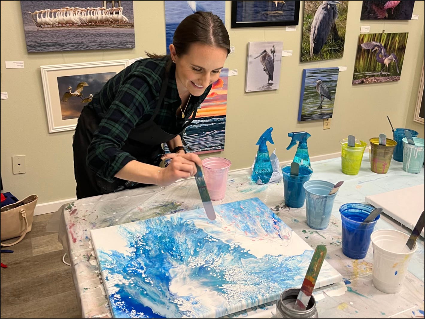 a woman painting acrylic art