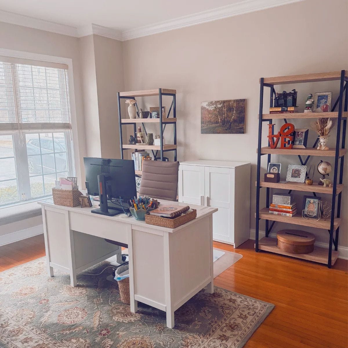 desk with bookshelves in home office.