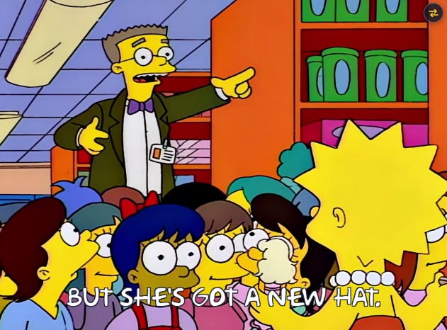 Smithers from the Simpsons, in a crowd of children in a toy store, pointing towards a Malibu Stacey doll and saying "But she's got a new hat."