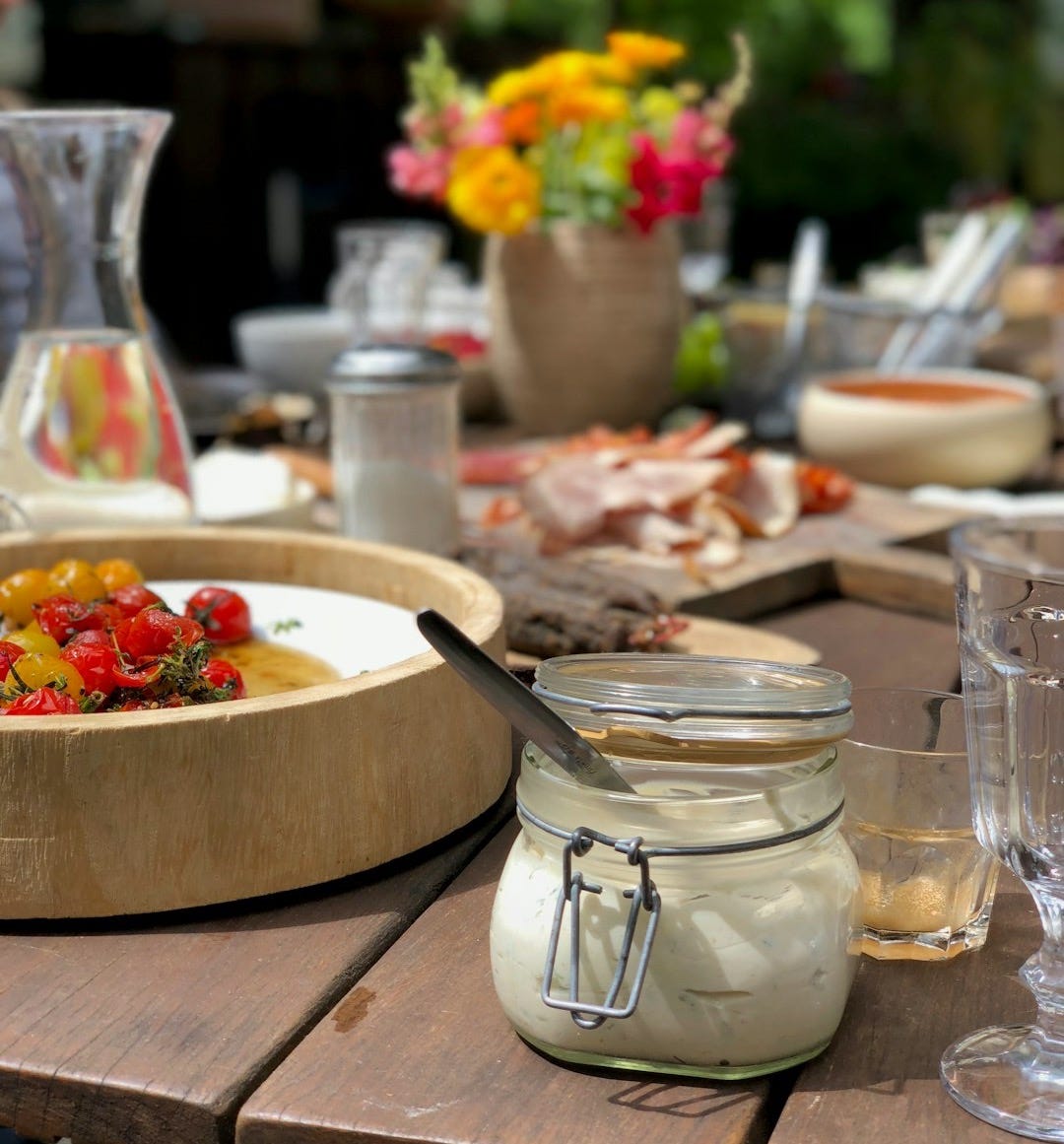 selective focus photography of clear glass canister with clamp lid