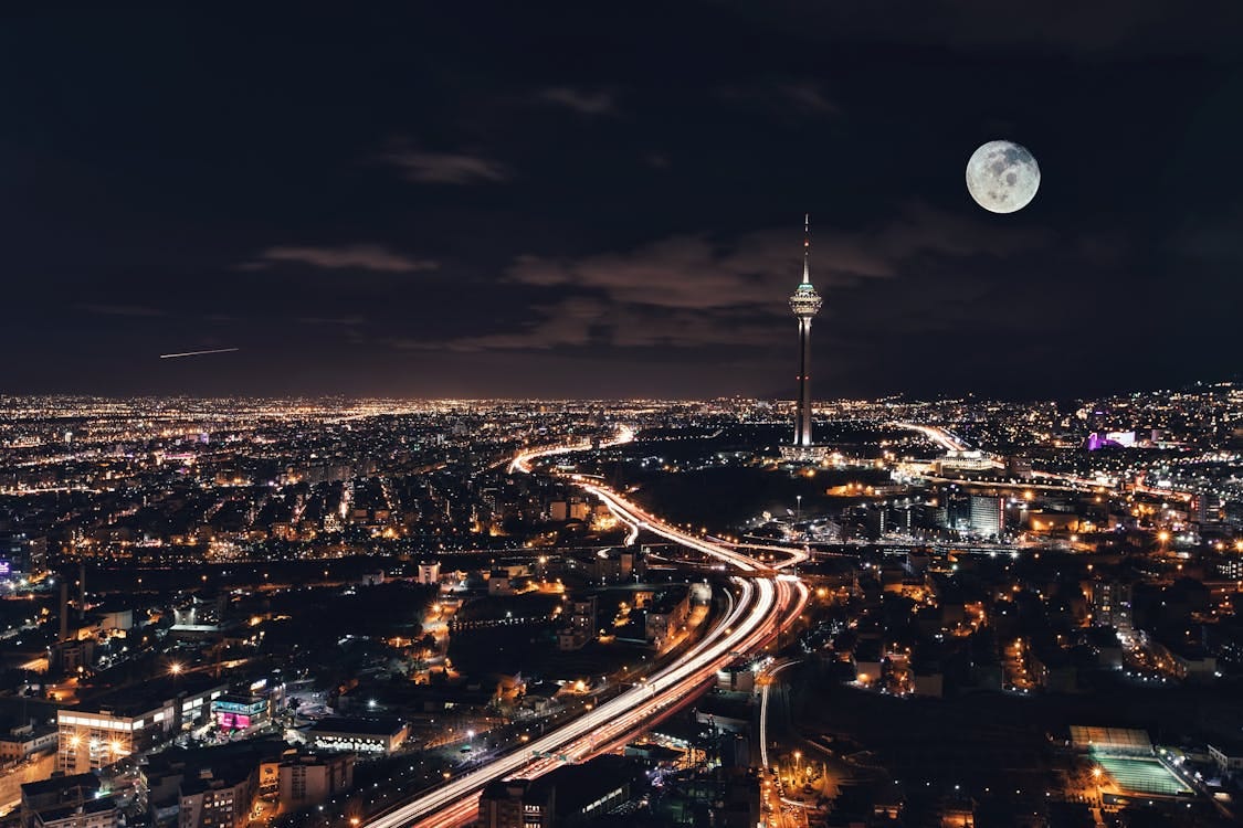 A nighttime cityscape of Tehran featuring Milad Tower, symbolizing light in darkness and the unseen revival rising across the nation. A nighttime cityscape of Tehran featuring Milad Tower, symbolizing light in darkness and the unseen revival rising across the nation.
