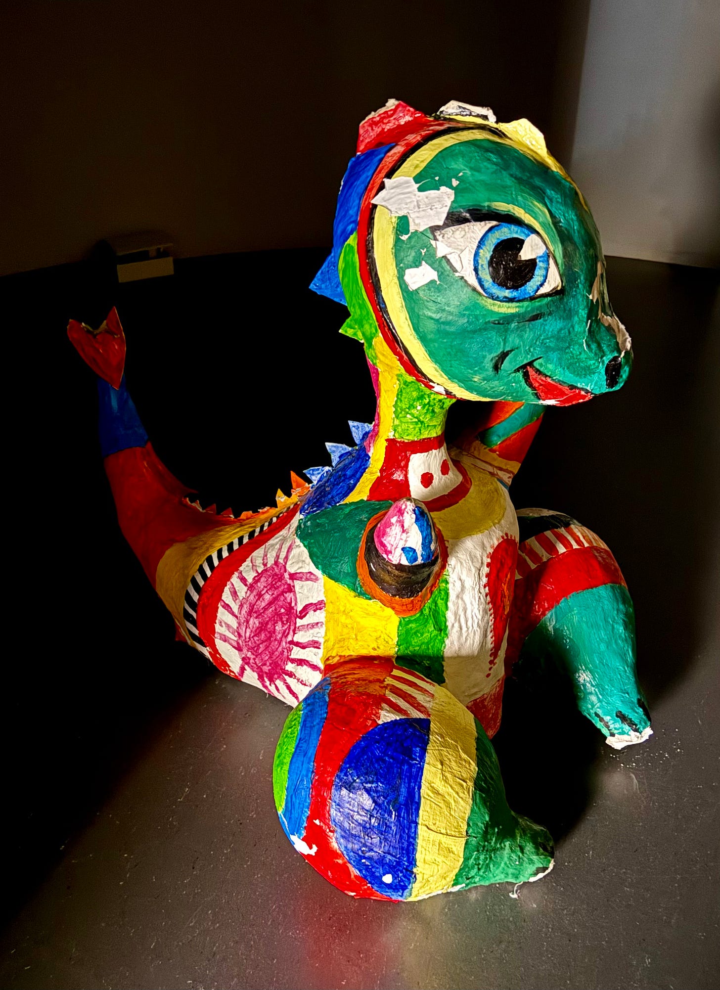 brightly coloured dragon, papier mache