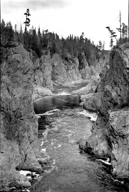 Images of a Wabanaki guide, two men carrying a deer on a pole, and a view of Ripogenus Gorge
