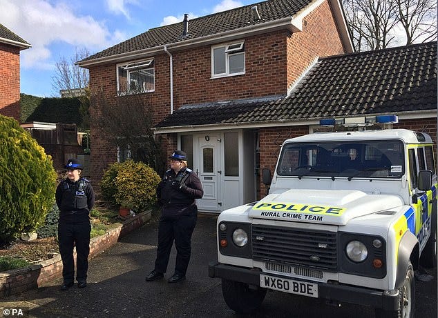 The Novichok was said to have been in a gel form, but would Skripal not have noticed this when he pulled the door to? He was, after all, trained in spycraft back in the 1970s. In any case, how many people does it take to close a door? Police are pictured above outside his house