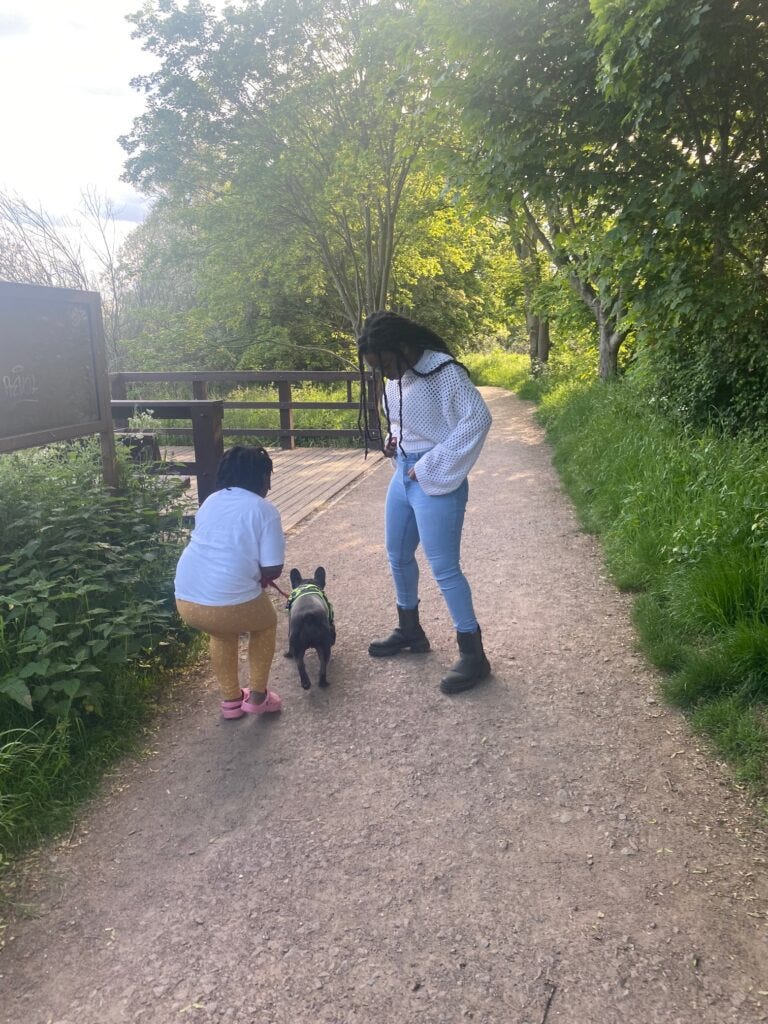 girls walking their dog